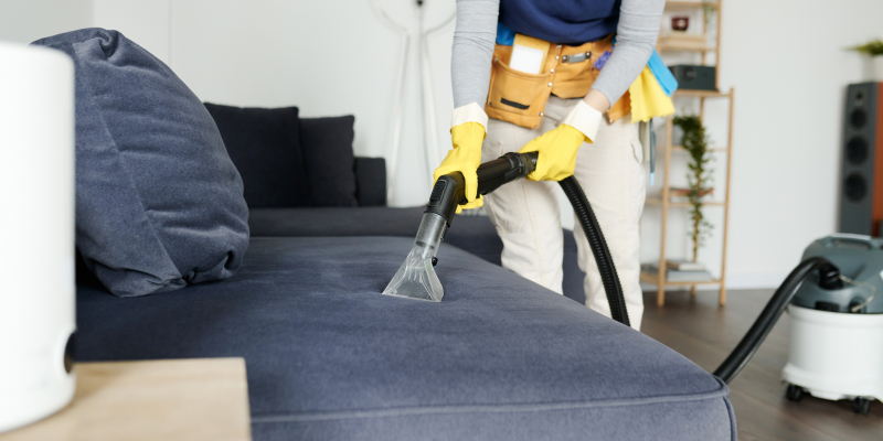 Person deep cleaning their home during winter to maintain a healthier, fresher living space.